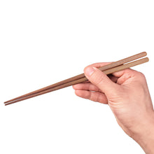 Load image into Gallery viewer, Ipe Chopsticks being held by hand. Custom or personalized options available