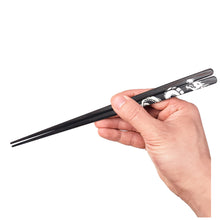 Load image into Gallery viewer, Black Wenge Chopsticks with dragon artwork. Full hand photo, not personalized