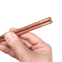 Load image into Gallery viewer, Bubinga Brown Wood Chopsticks detail. Custom personalized engraving shown