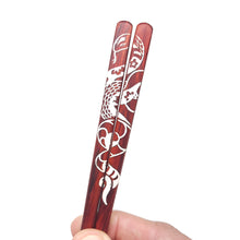 Load image into Gallery viewer, Detail image of snake artwork on Redheart red Chopsticks
