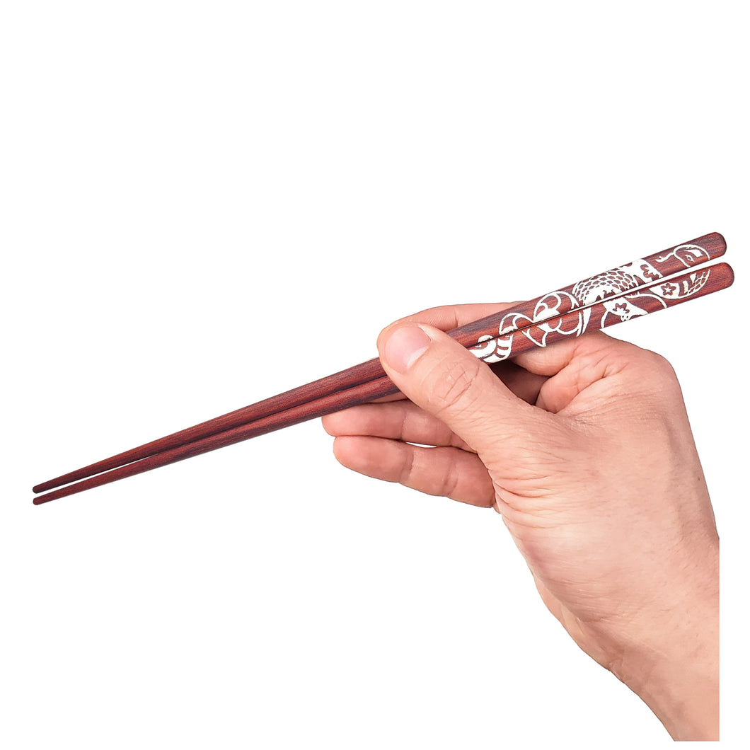 Redheart white snake art chopsticks. Full hand image. Not personalized